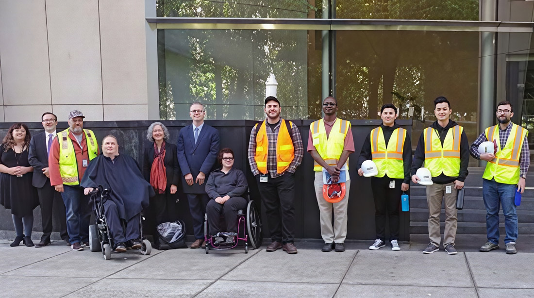 Plaintiffs and City Representatives posing in front of federal court after final approval hearing.
